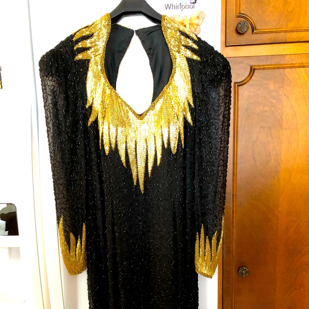 Evening dressSilk beaded w lining and gold trim on collarsleeves & back. Pd $900